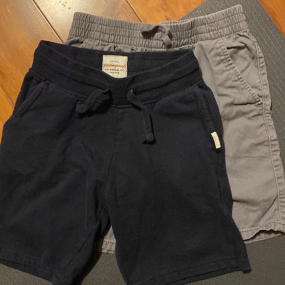 2 boy shorts. One gray one blue. Size s/boy 8.